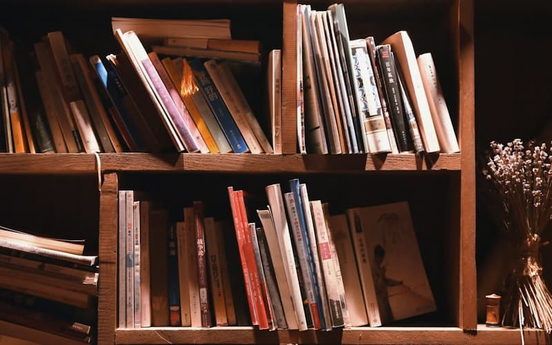 Stack of unfinished books with bookmarks